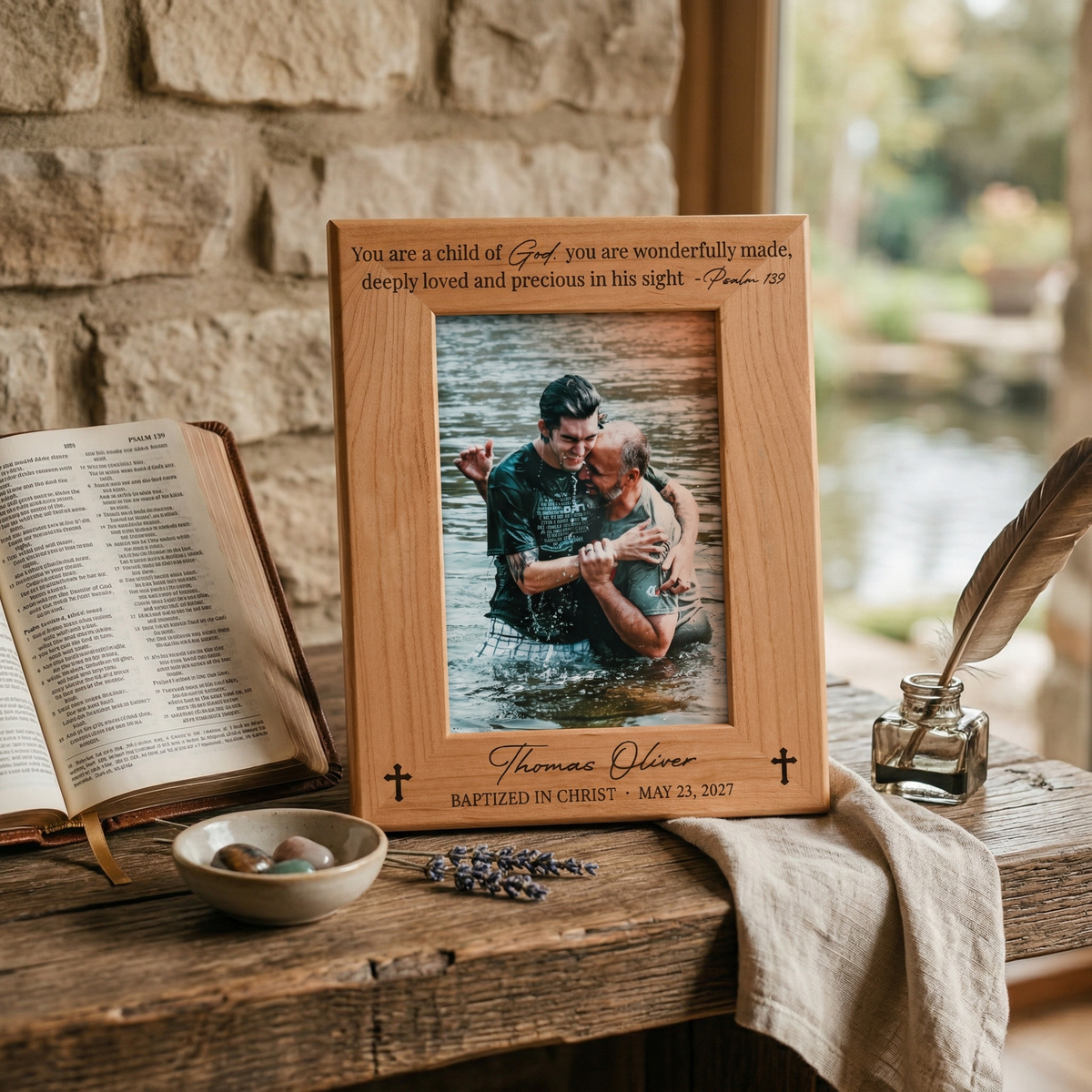 Engraved wood baptism frame with Psalm 139 verse and Baptized in Christ, name and date, on a rustic wooden table beside an open Bible
